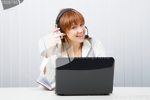 Image of girl in headphones with a microphone