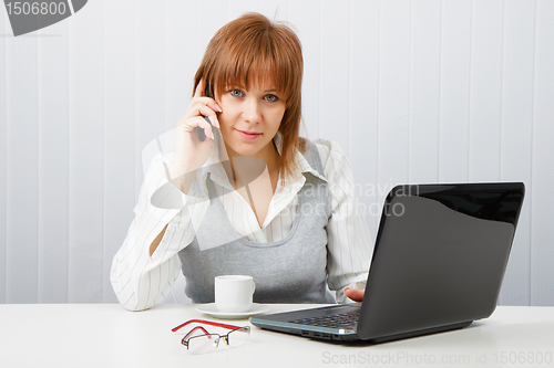 Image of Attractive girl talking on the phone