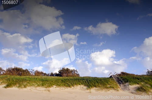 Image of Coast dune and stair leading up cover sea sand.