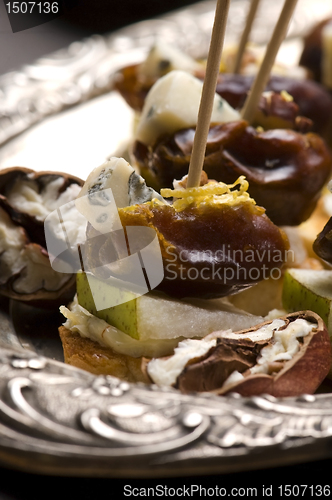 Image of Appetizer Plate with Dactyl, Pecan nuts and Cheese