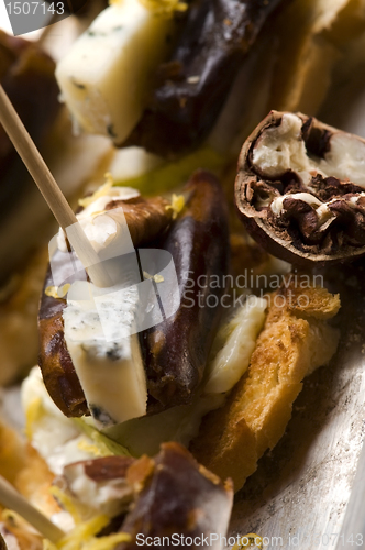 Image of Appetizer Plate with Dactyl, Pecan nuts and Cheese