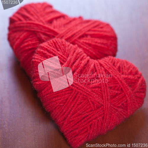 Image of two red thread hearts 