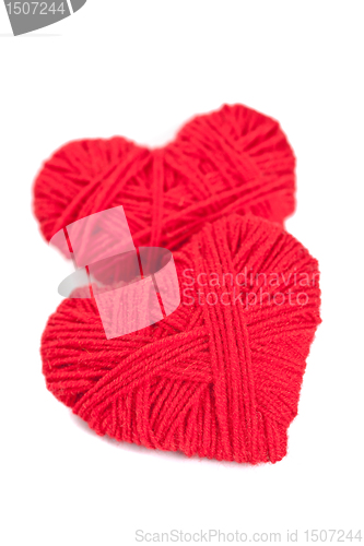 Image of two red thread hearts