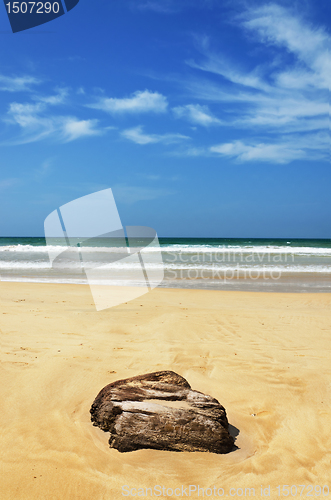 Image of stones in the waves on ocean coast