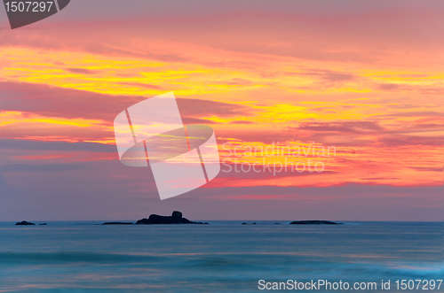 Image of ocean shore at sunset