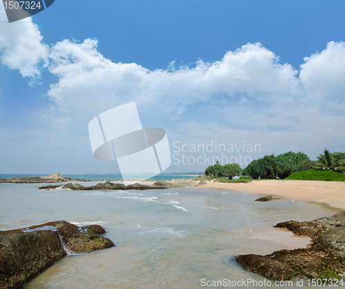 Image of stones in the waves on ocean coast