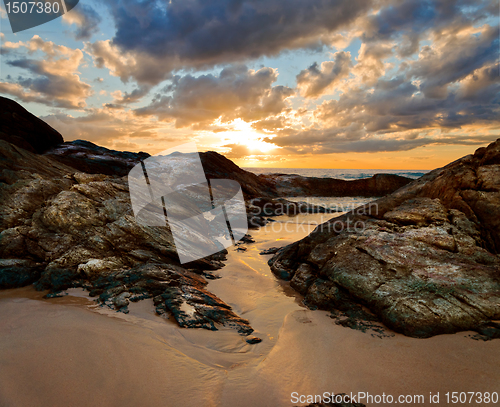 Image of ocean shore at sunset