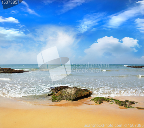 Image of stones in the waves on ocean coast