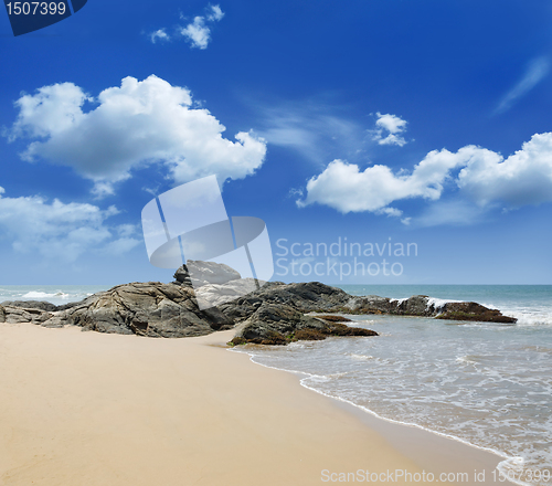 Image of stones in the waves on ocean coast