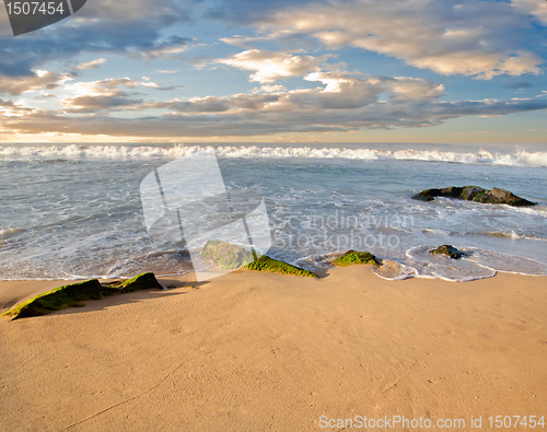 Image of stones in the waves on ocean coast