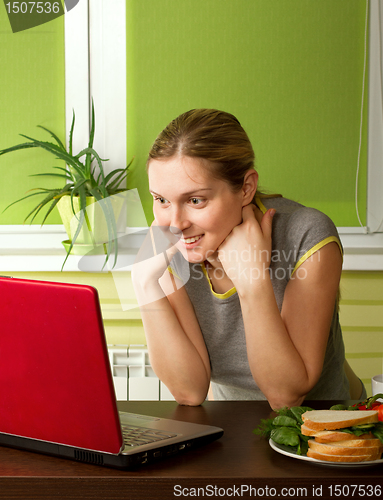 Image of tender pregnant female with laptop