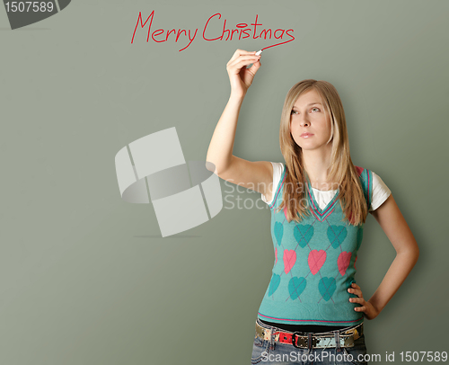 Image of woman writting Merry Christmas