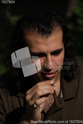 Image of Person Smoking a Cigar