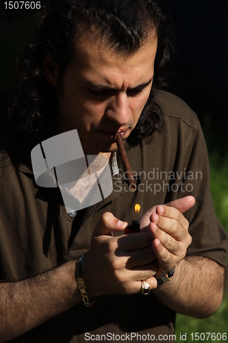 Image of Person Smoking a Cigar