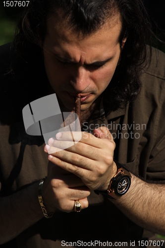 Image of Person Smoking a Cigar