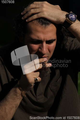 Image of Person Smoking a Cigar