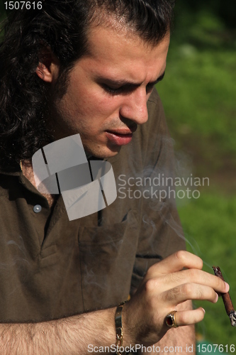 Image of Person Smoking a Cigar