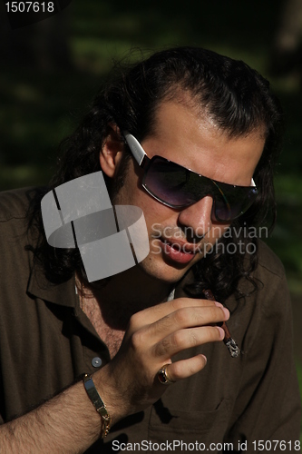 Image of Person Smoking a Cigar