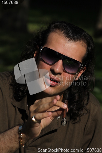 Image of Person Smoking a Cigar