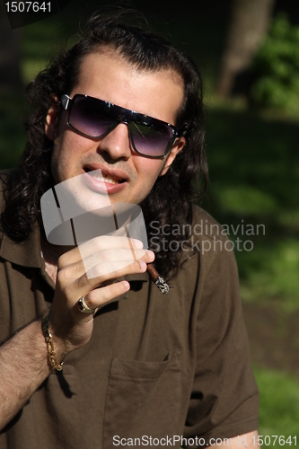 Image of Person Smoking a Cigar