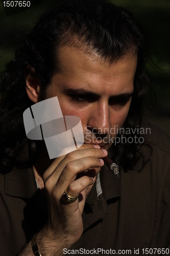 Image of Person Smoking a Cigar