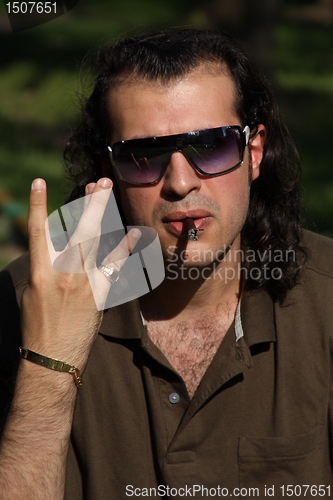 Image of Person Smoking a Cigar