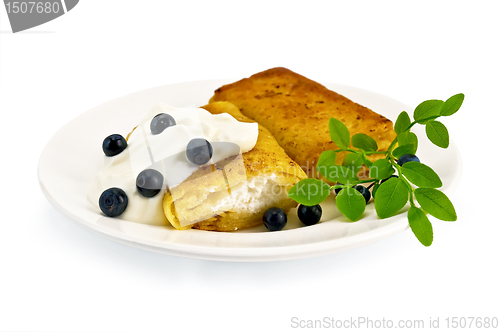 Image of Pancakes with cottage cheese and blueberries on the plate
