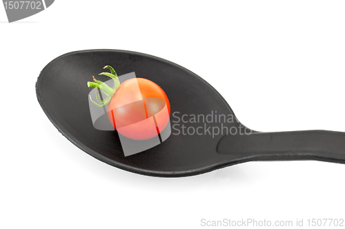 Image of Tomato on a black spoon