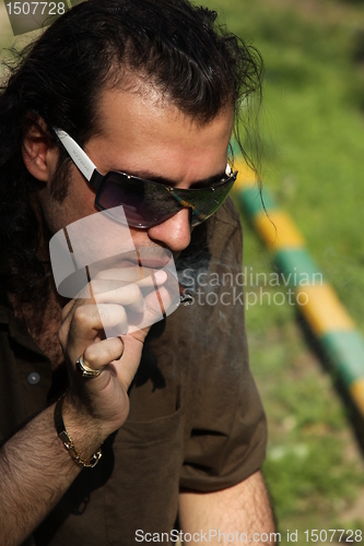 Image of Person Smoking a Cigar