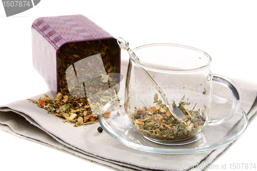 Image of Set of dried herbs, fruits and spices in tea cup.