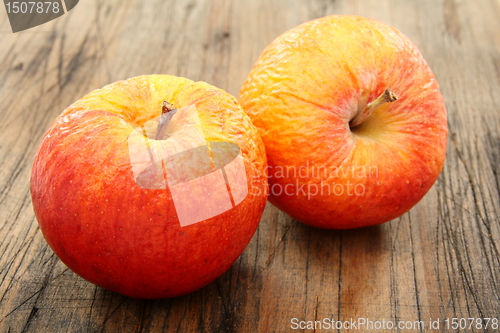 Image of Two shriveled apples.