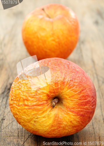 Image of Two shriveled apples.