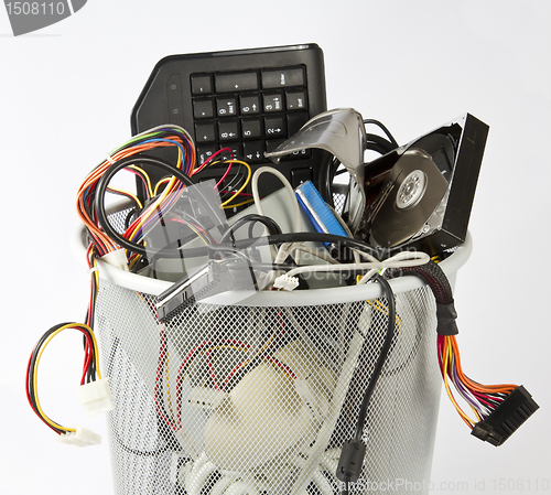 Image of electronic parts from computers in trash can