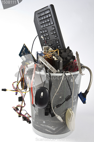 Image of electronic scrap in trash can