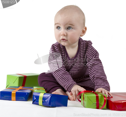 Image of young child unpacking presents