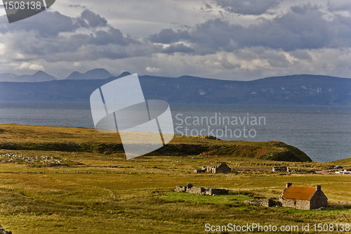 Image of old abandoned houses at scottish coastline