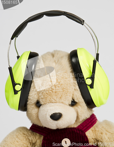 Image of teddy bear with ear protection