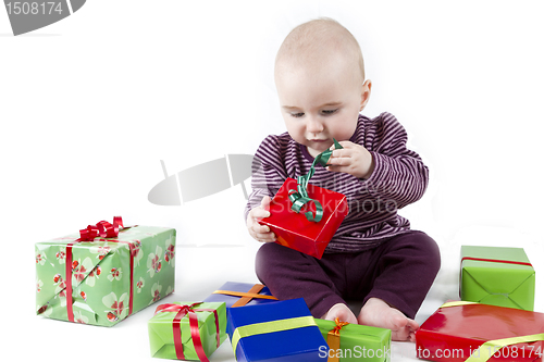 Image of young child unpacking presents