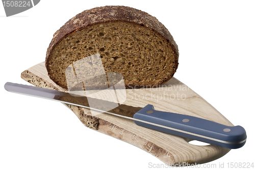 Image of brown bread on shelf with knife