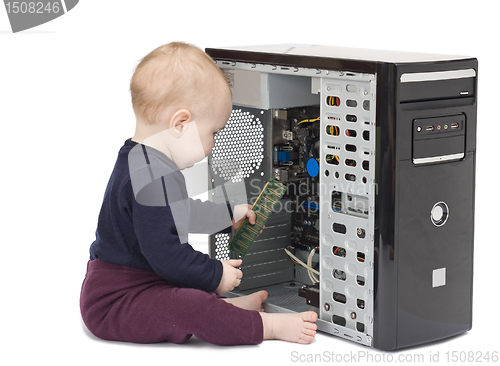 Image of young child with open computer