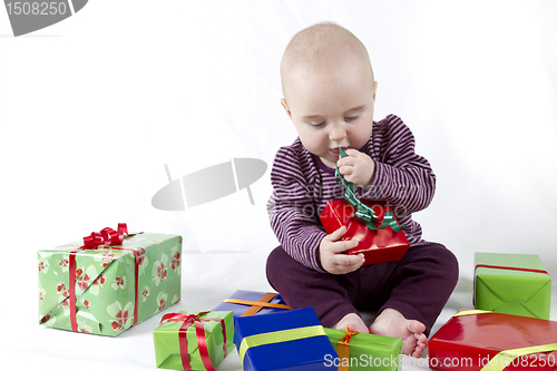 Image of young child unpacking presents