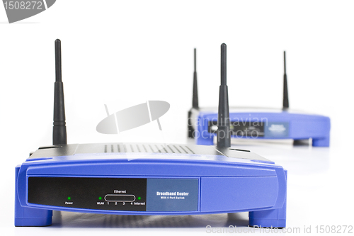 Image of two blue internet router with two antennas