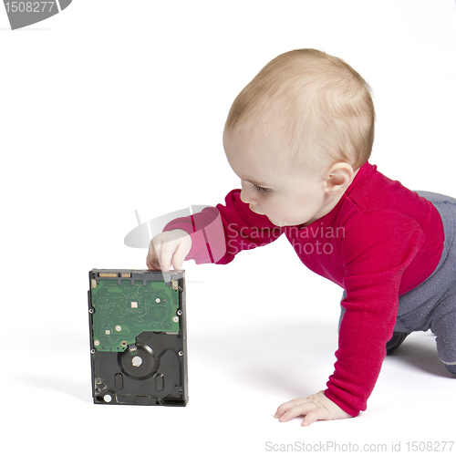 Image of young child in white background with hard drive