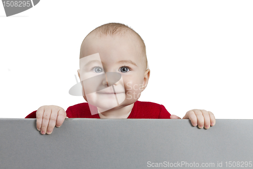 Image of young child holding shield