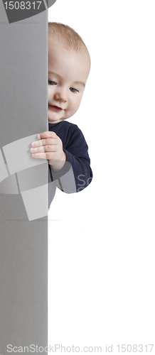 Image of young child holding vertical sign