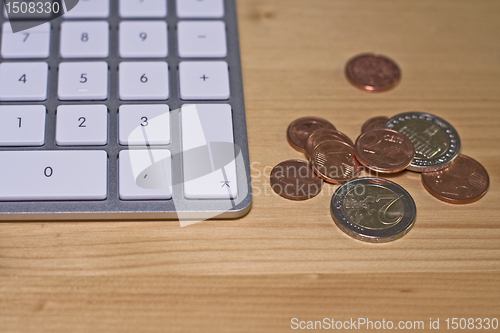 Image of keyboard wood and coins