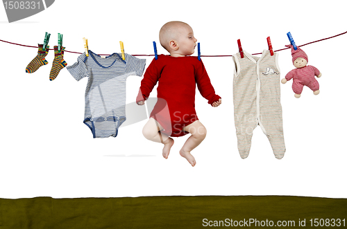 Image of young child at clothes line