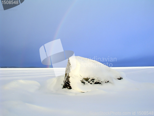 Image of Rainbow over the frozen lake