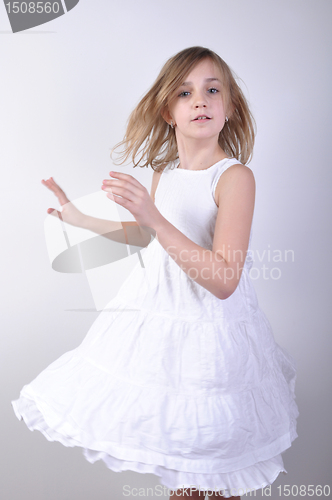 Image of dancing young blond girl