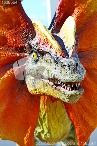 Image of Dilophosaurus dinosaur with orange collar